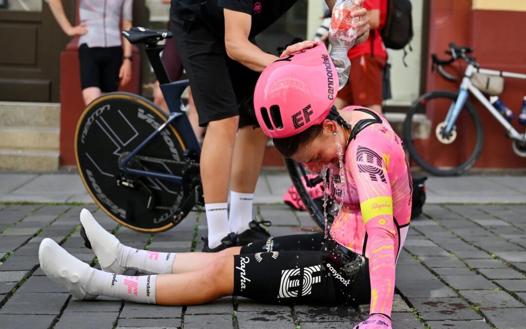 Professional cyclist cooling down after a hot race, demonstrating the physical impact of Australian summer heat and the importance of heat adaptation.